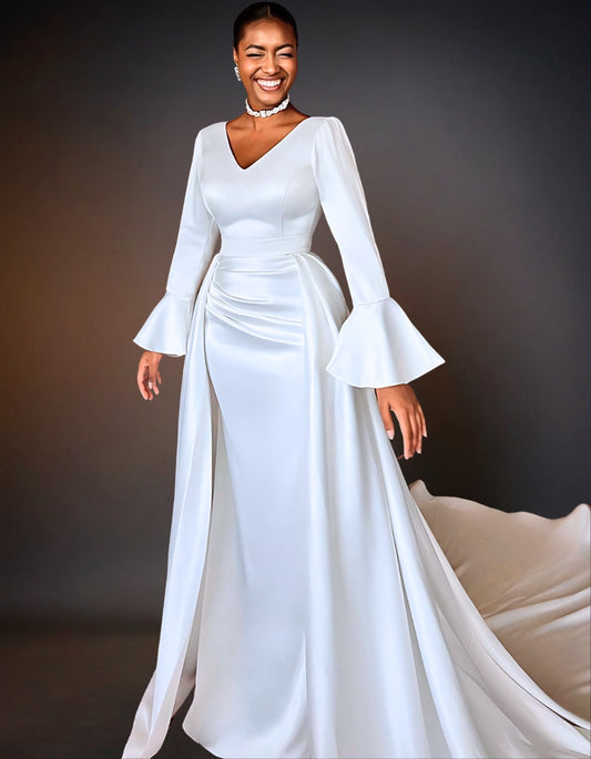 A luxury satin mermaid wedding dress. The dress features long sleeves and a fitted silhouette that flares out at the bottom.