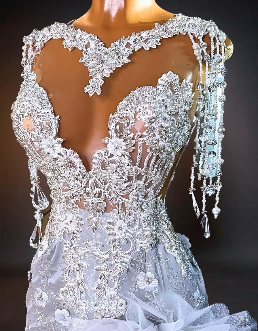 An elegant wedding dress adorned with intricate crystal orchids and sparkling rhinestones, capturing the luxury and glamour of a high-end bridal gown.