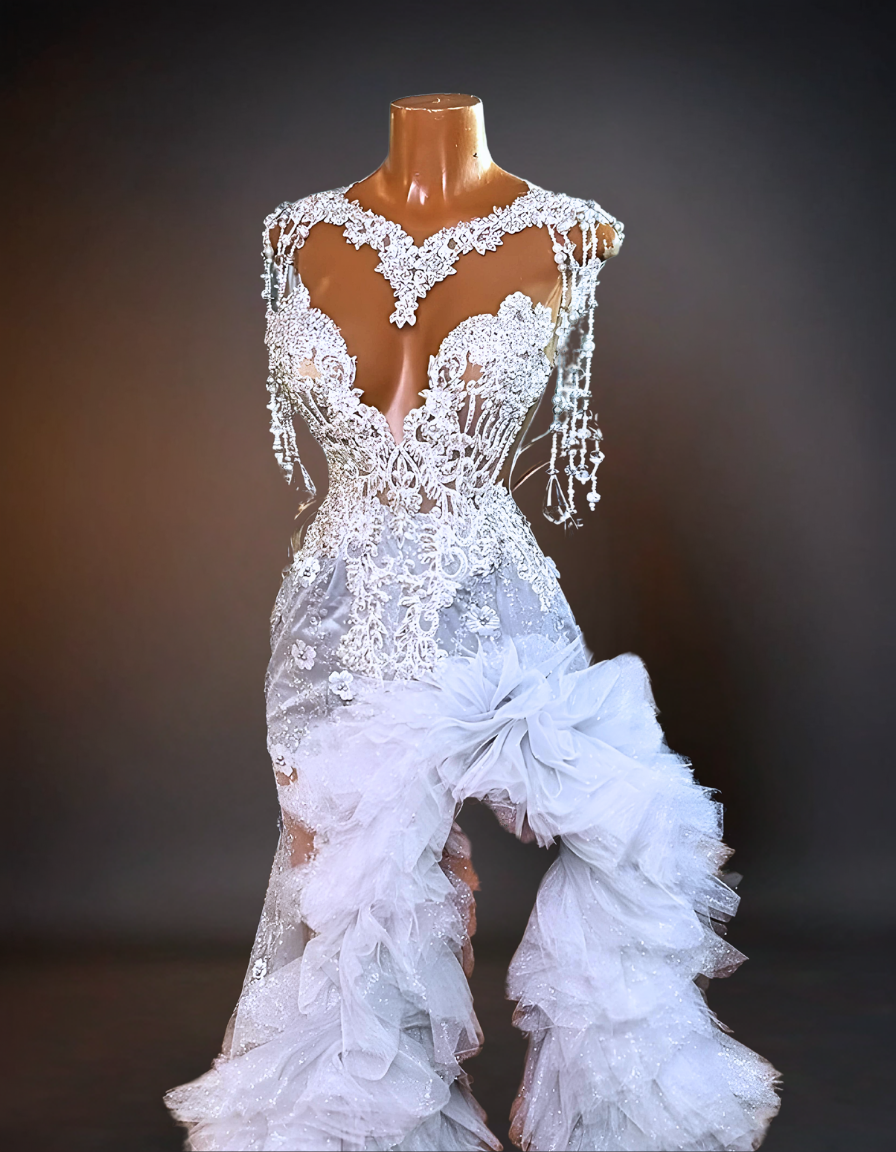 An elegant wedding dress adorned with intricate crystal orchids and sparkling rhinestones, capturing the luxury and glamour of a high-end bridal gown.