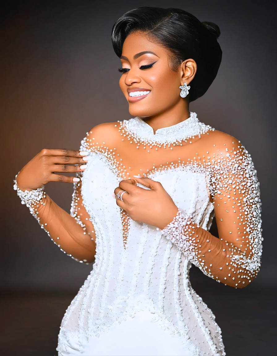 A luxurious mermaid wedding dress displayed on Shopify, featuring sheer long sleeves.