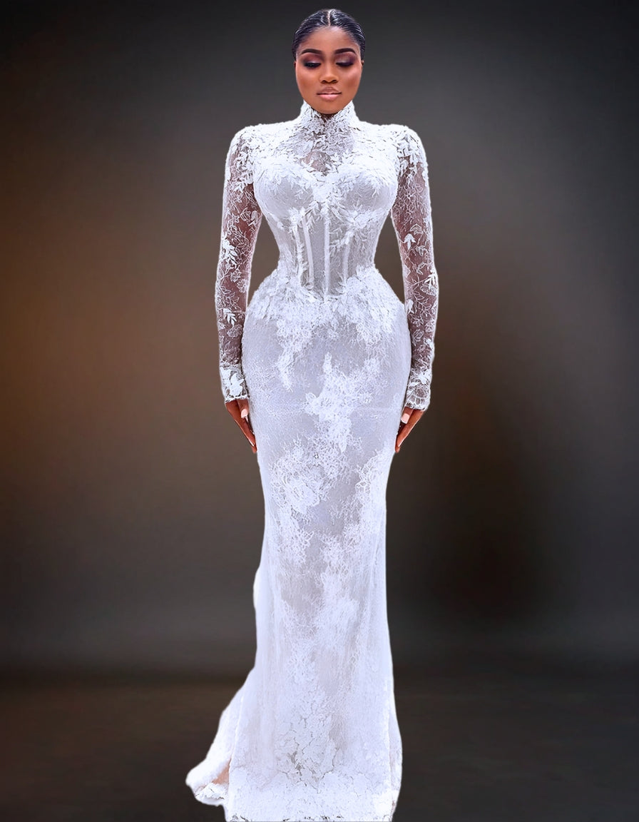 A stunning luxury wedding dress with a mermaid silhouette, featuring shiny beads and pearls.