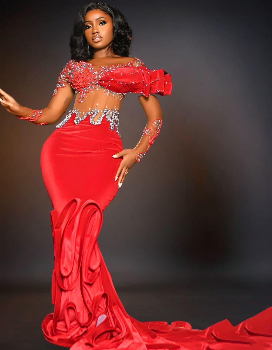 A luxury long red prom mermaid dress with a tail is displayed. The dress features a fitted bodice that flares out at the knees, creating a dramatic, elegant tail.