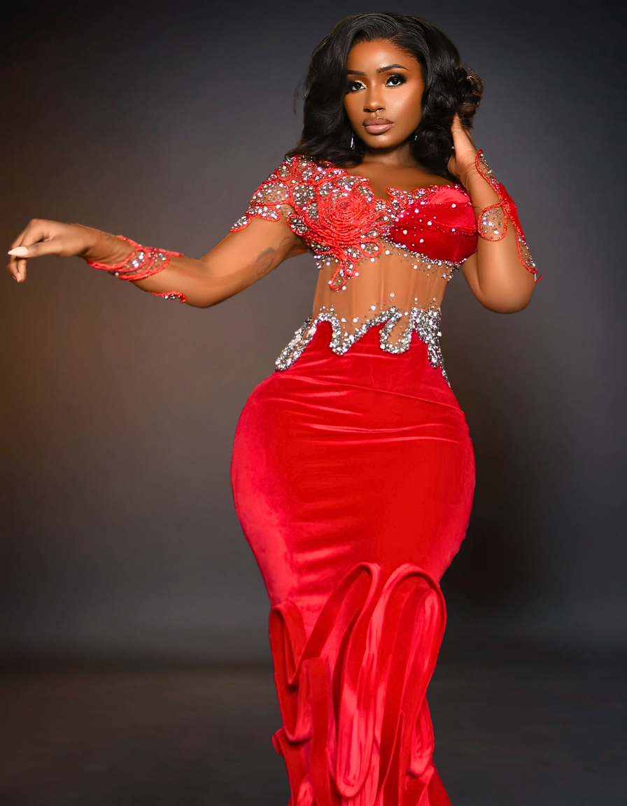 A luxury long red prom mermaid dress with a tail is displayed. The dress features a fitted bodice that flares out at the knees, creating a dramatic, elegant tail.