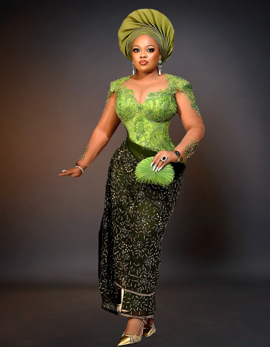luxurious traditional African wedding attire, known as Aso Ebi. The outfit is a rich green color, featuring intricate gold embroidery and embellishments.