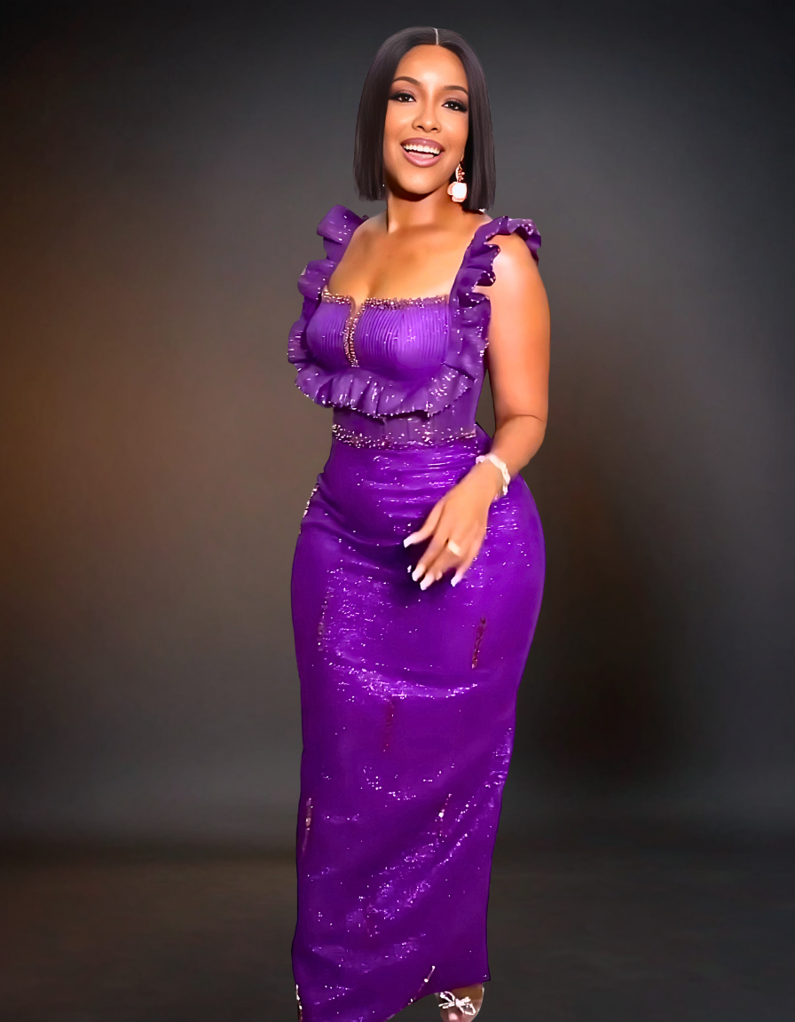 An elegant purple evening dress with luxurious fabric and intricate detailing.