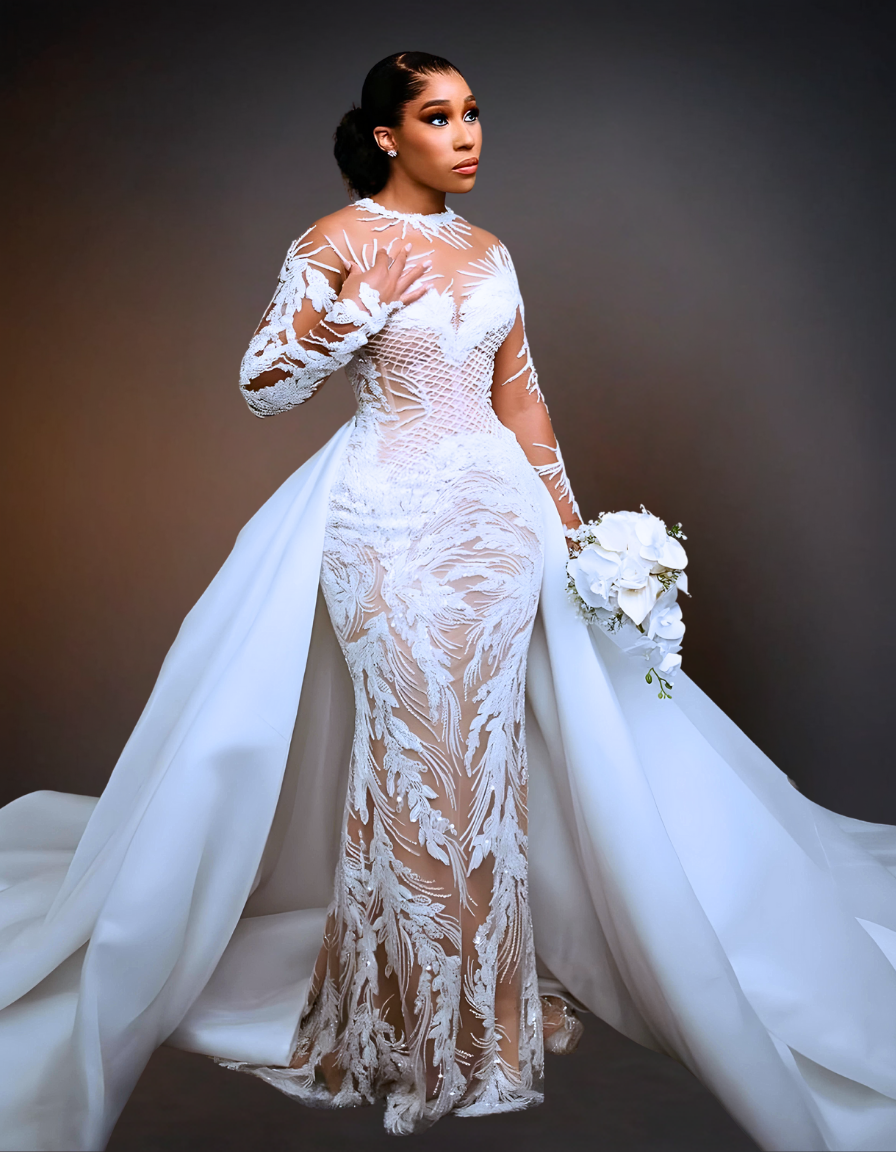 White mermaid-style wedding dress with illusion neckline and detachable train, perfect for a luxurious bridal look.