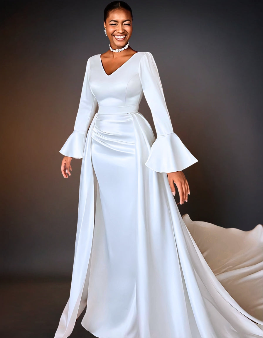 A luxury satin mermaid wedding dress. The dress features long sleeves and a fitted silhouette that flares out at the bottom.