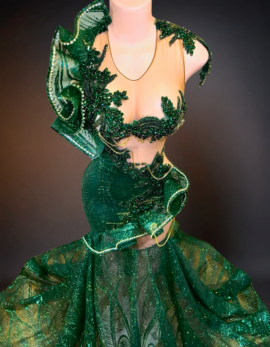 Green luxury long prom dress adorned with intricate lace and beading details.