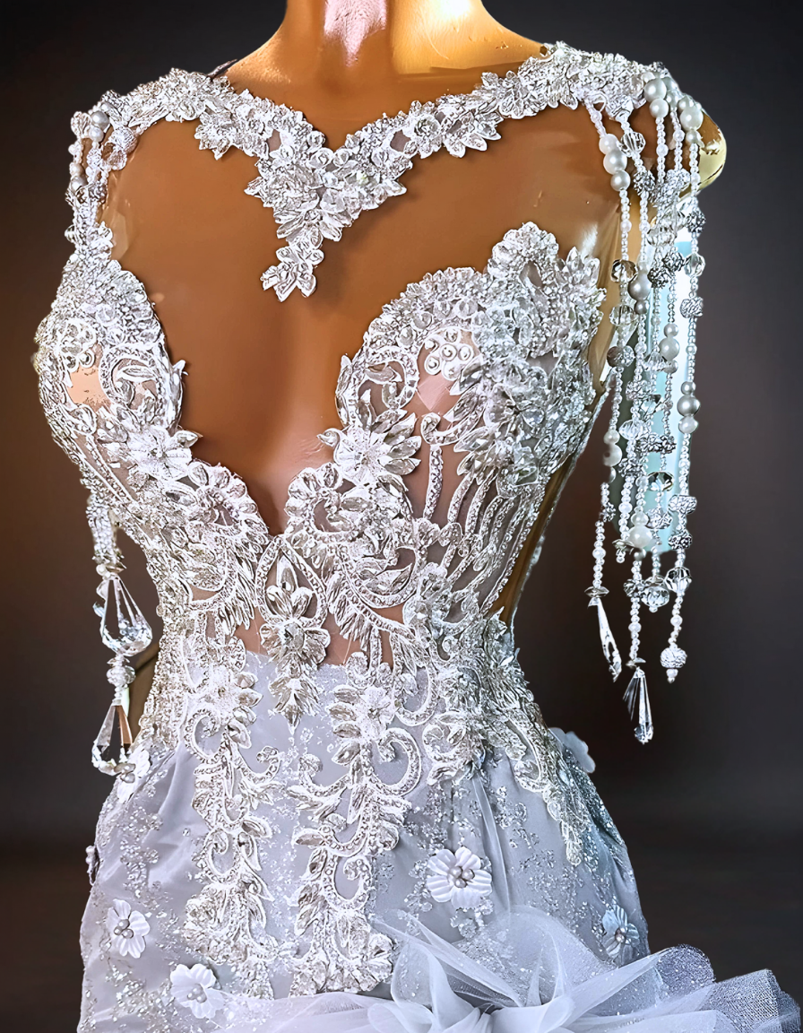 An elegant wedding dress adorned with intricate crystal orchids and sparkling rhinestones, capturing the luxury and glamour of a high-end bridal gown. 