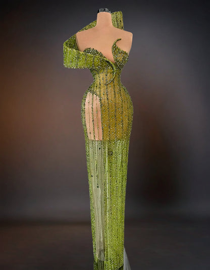  A luxurious green dress adorned with intricate stone embellishments.