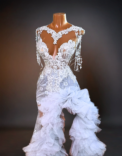 An elegant wedding dress adorned with intricate crystal orchids and sparkling rhinestones, capturing the luxury and glamour of a high-end bridal gown. 