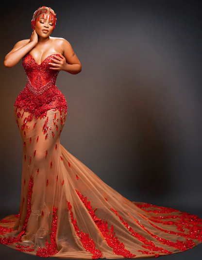 Luxury transparent red prom dress featuring stunning, sheer design with intricate details and a flowing skirt, perfect for making a statement at any formal event.