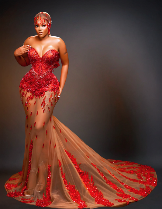 Luxury transparent red prom dress featuring stunning, sheer design with intricate details and a flowing skirt, perfect for making a statement at any formal event.