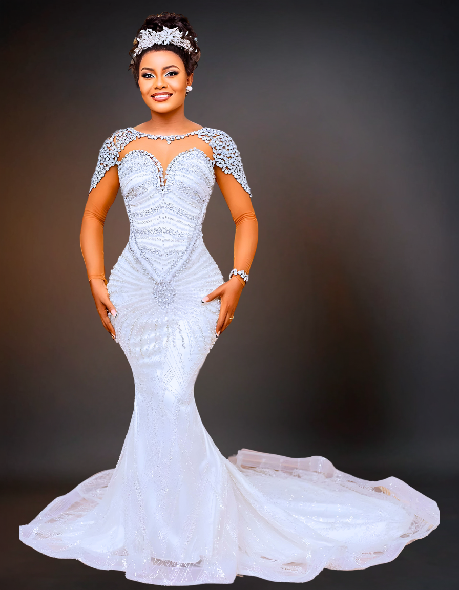  A luxurious mermaid wedding dress featuring a sheer neckline adorned with pearls. The dress includes a detachable skirt, adding versatility and elegance to the design. 