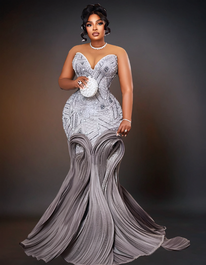 A stunning luxury long sequin mermaid prom dress in silver.