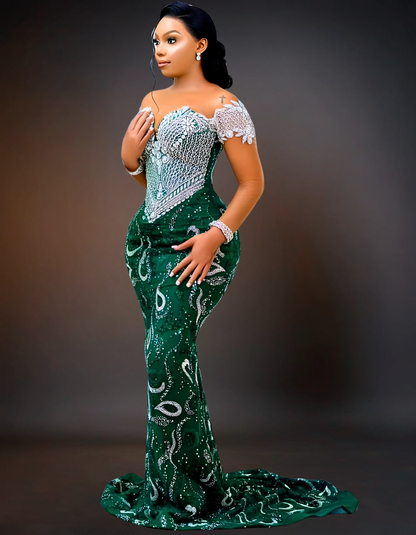 Luxury silver off-shoulder prom dress with emerald embellishments.