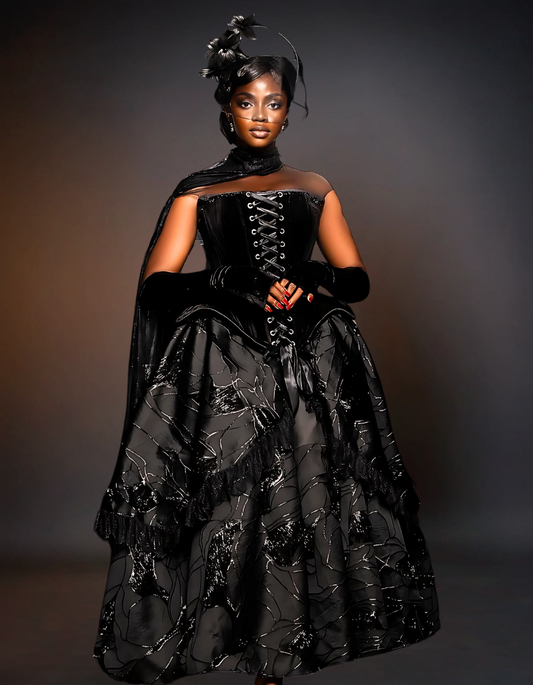 A luxurious black prom gown displayed on Shopify, featuring an intricate rope corset design. The gown has a sophisticated and elegant appearance, perfect for formal events.