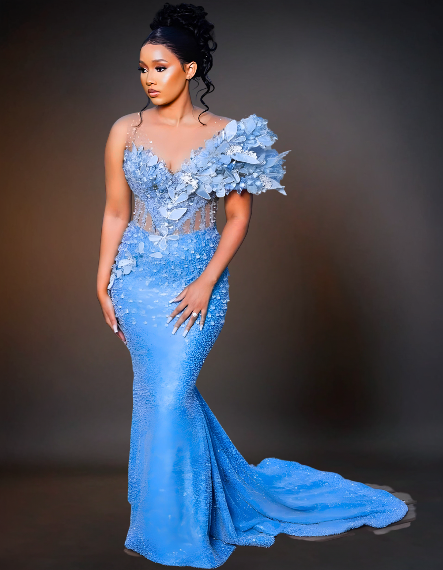 A stunning luxury long prom dress in a beautiful shade of blue, adorned with intricate pearl detailing. The gown features a fitted bodice and a flowing skirt, creating an elegant and sophisticated look perfect for special occasions.