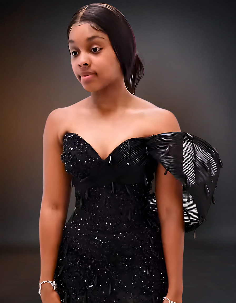 Elegant black lace prom dress adorned with beads, perfect for formal occasions.