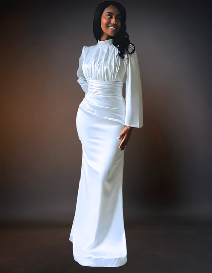  A simple, elegant long sleeve satin wedding dress with a turtle neck