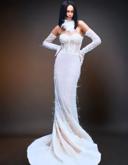 Alt text: Luxury Feather Wedding Gown with Detachable Sleeve, featuring intricate feather detailing, a fitted bodice, and an elegant train.