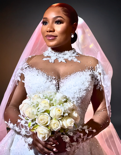 Elegant bride wearing a luxurious lace wedding dress with long sleeves, showcasing intricate detailing and a flowing train. 