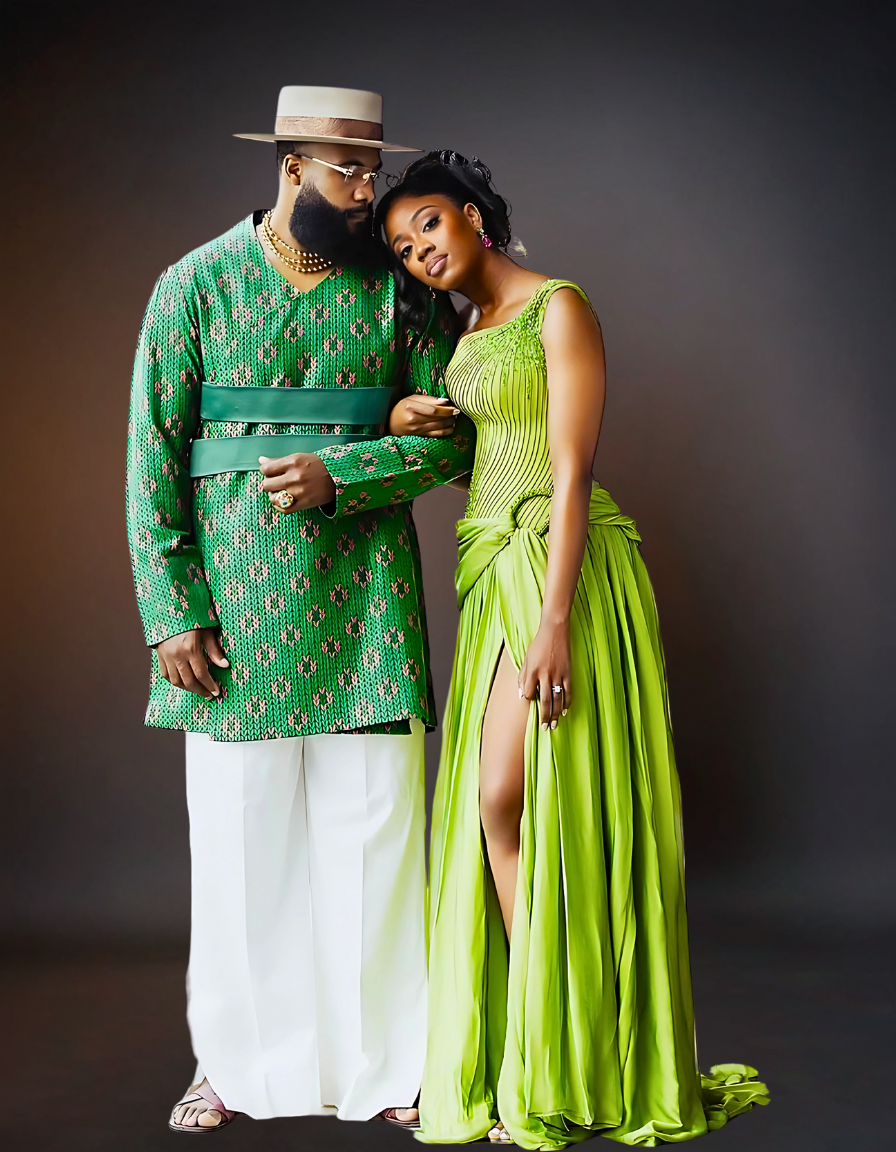  A sophisticated couple is elegantly dressed in coordinating green attire. The woman is wearing a stylish green dress, while the man is dressed in a sharp green shirt..