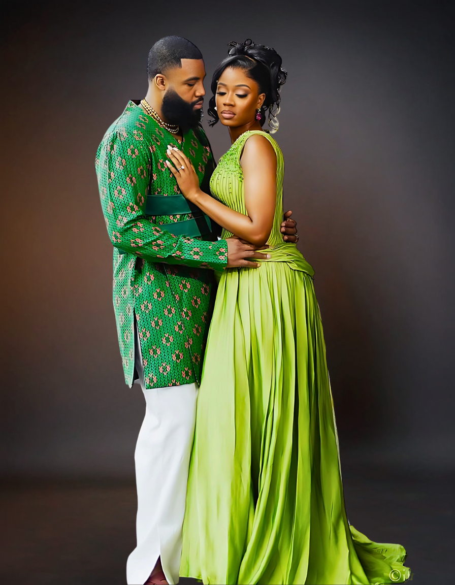  A sophisticated couple is elegantly dressed in coordinating green attire. The woman is wearing a stylish green dress, while the man is dressed in a sharp green shirt..