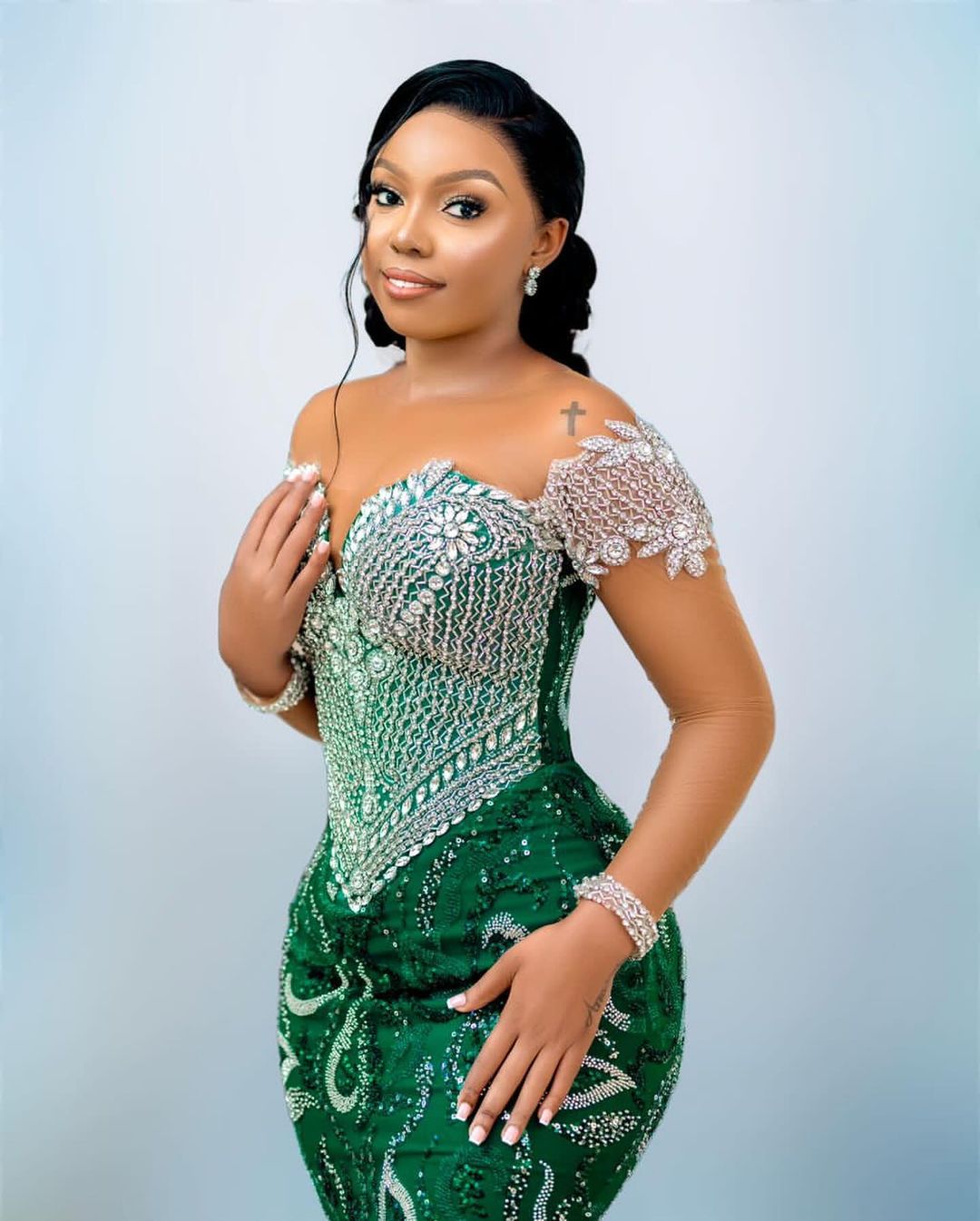 Luxury silver off-shoulder prom dress with emerald embellishments 