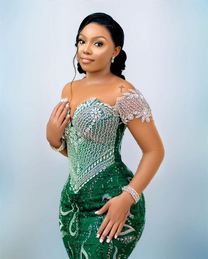 Luxury silver off-shoulder prom dress with emerald embellishments 