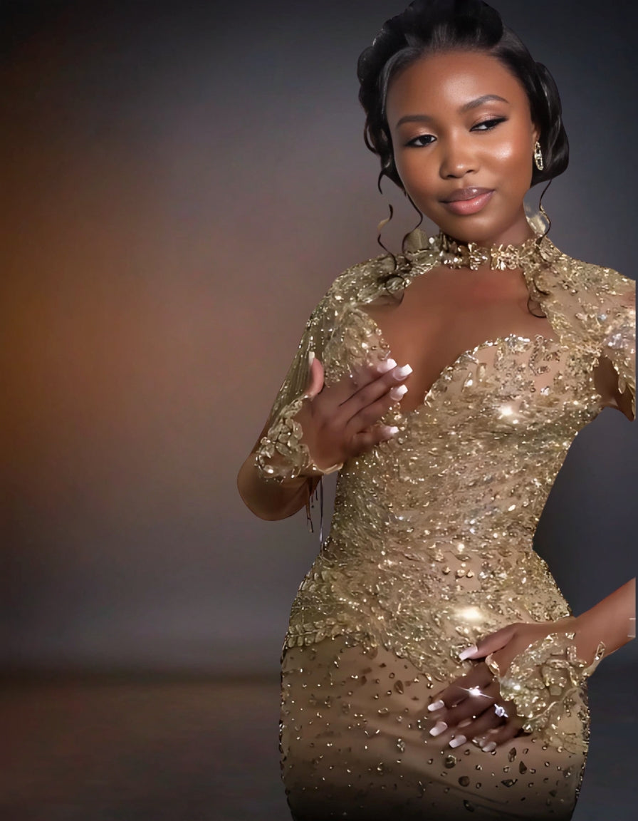 Shimmering gold prom dress with luxurious glitter embellishments.