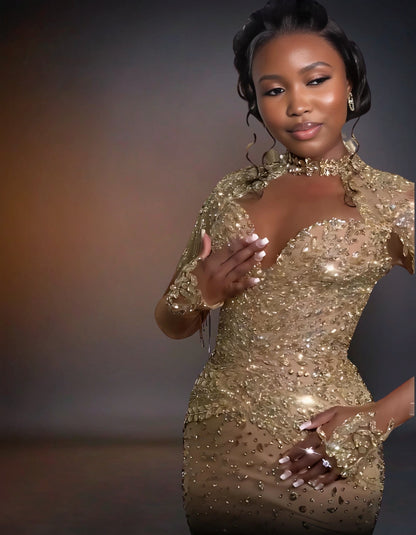 Shimmering gold prom dress with luxurious glitter embellishments.