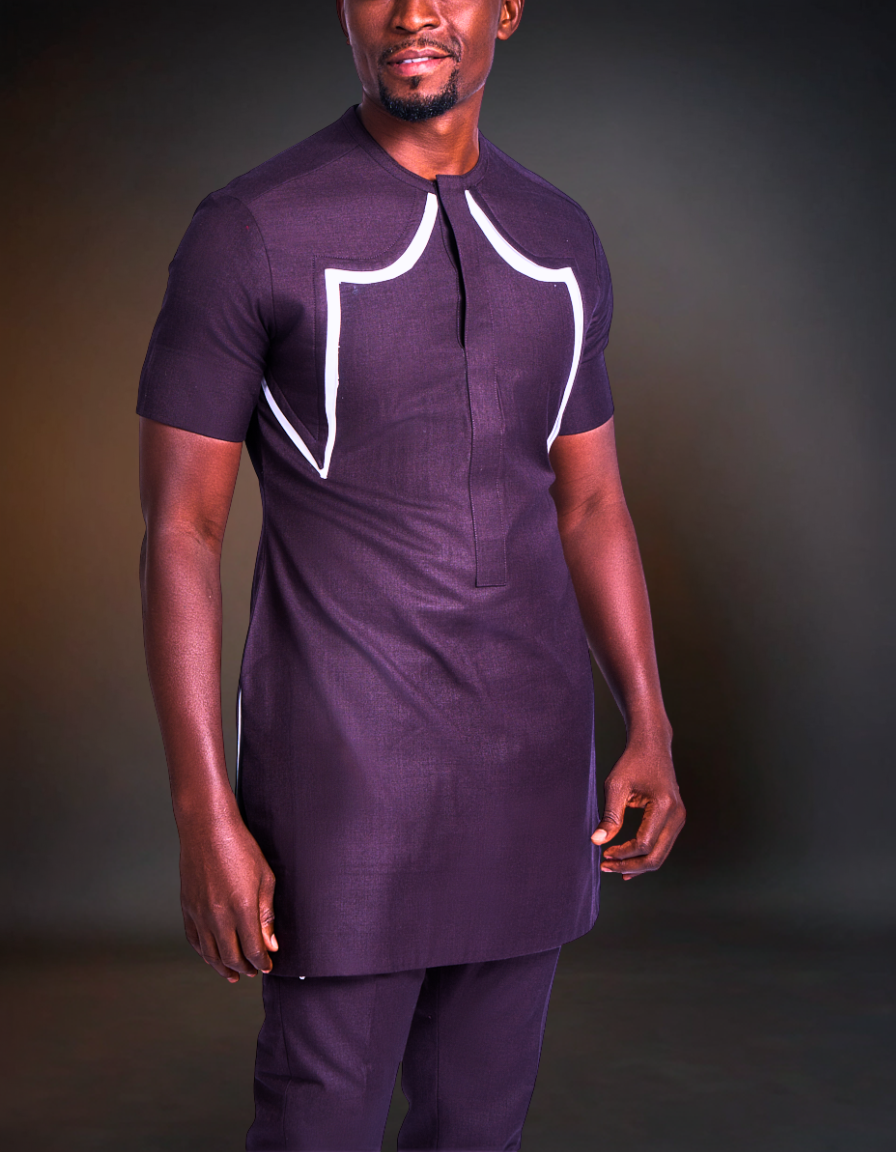 Man wearing a purple outfit with white accents against a dark background