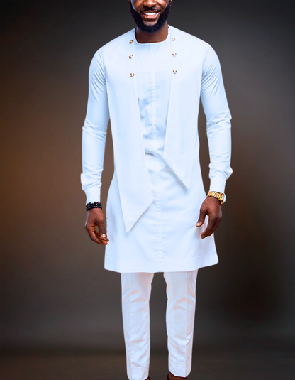 Man wearing a light blue traditional outfit with white pants against a dark background