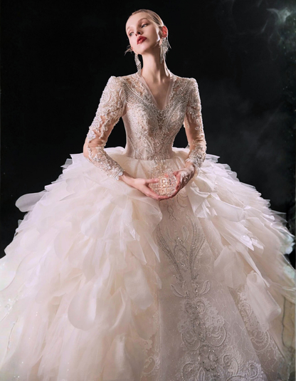 Elegant wedding dress with intricate detailing on a dark background