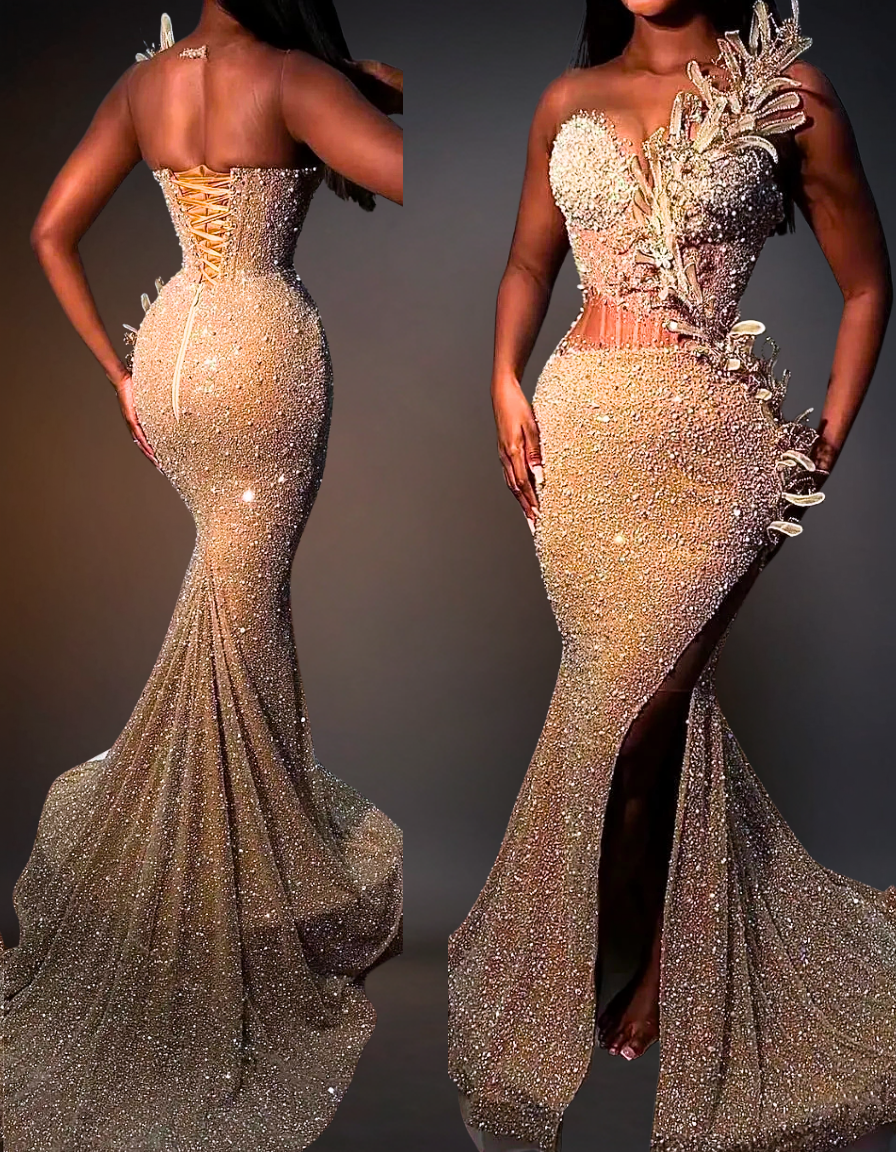 Woman wearing a sparkling mermaid-style gown with floral details on a dark background