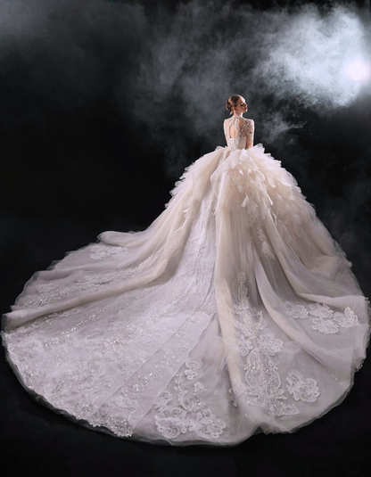 Elegant white wedding dress with a long train on a dark background