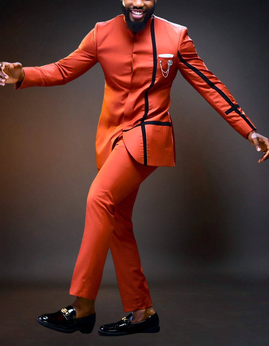 Man wearing an orange suit with black accents on a dark background